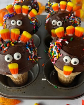 Cupcakes decorated to look like cute turkeys with candy.