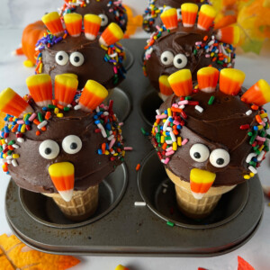 Cupcakes decorated to look like cute turkeys with candy.