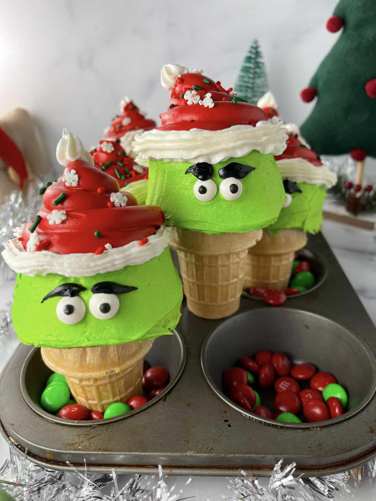 Christmas Grinch cupcakes baked in ice cream cones.