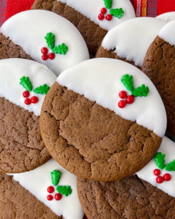 Ginger molasses cookies on a plaid cloth.