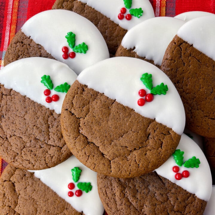 Ginger molasses cookies on a plaid cloth.