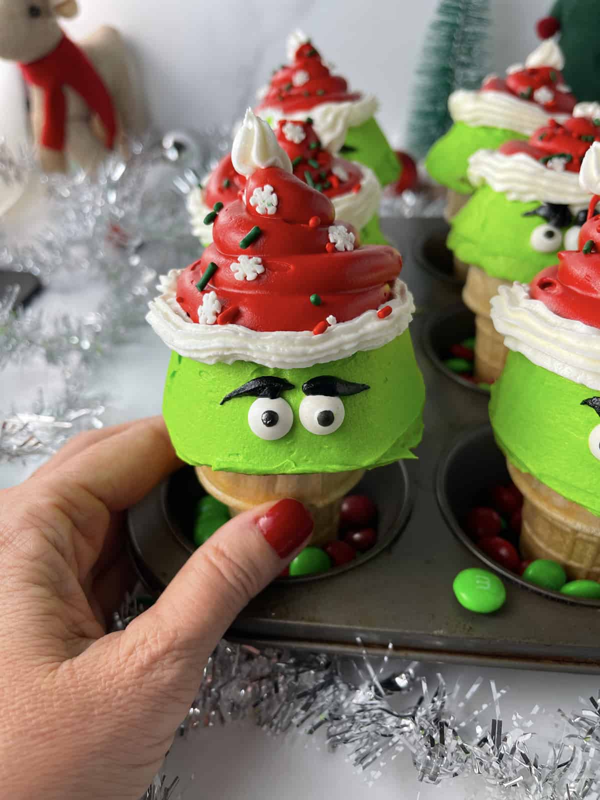 Christmas Grinch movie cupcakes baked in ice cream cones.