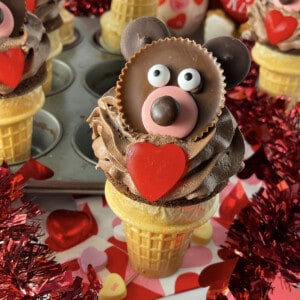 Adorable teddy bear cupcake made in an ice cream cone with heart.