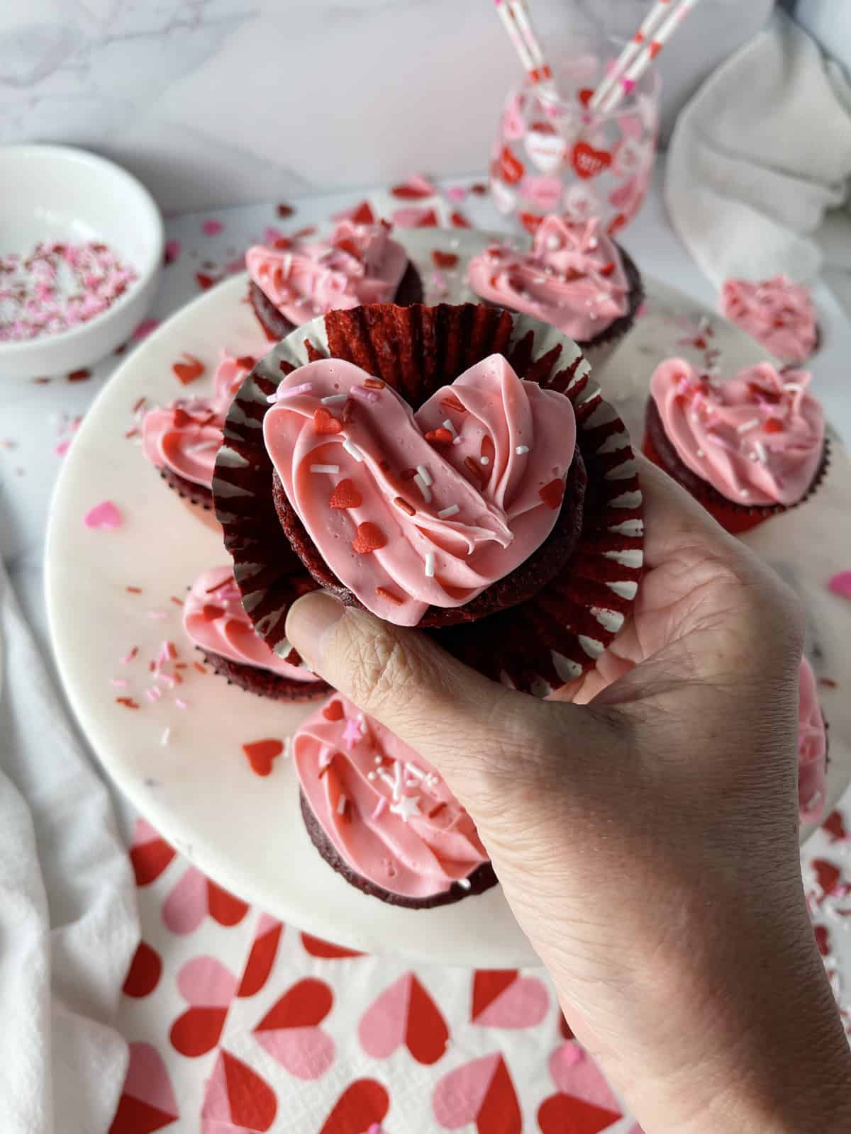 Red velvet cupcakes in the shape of a heart.