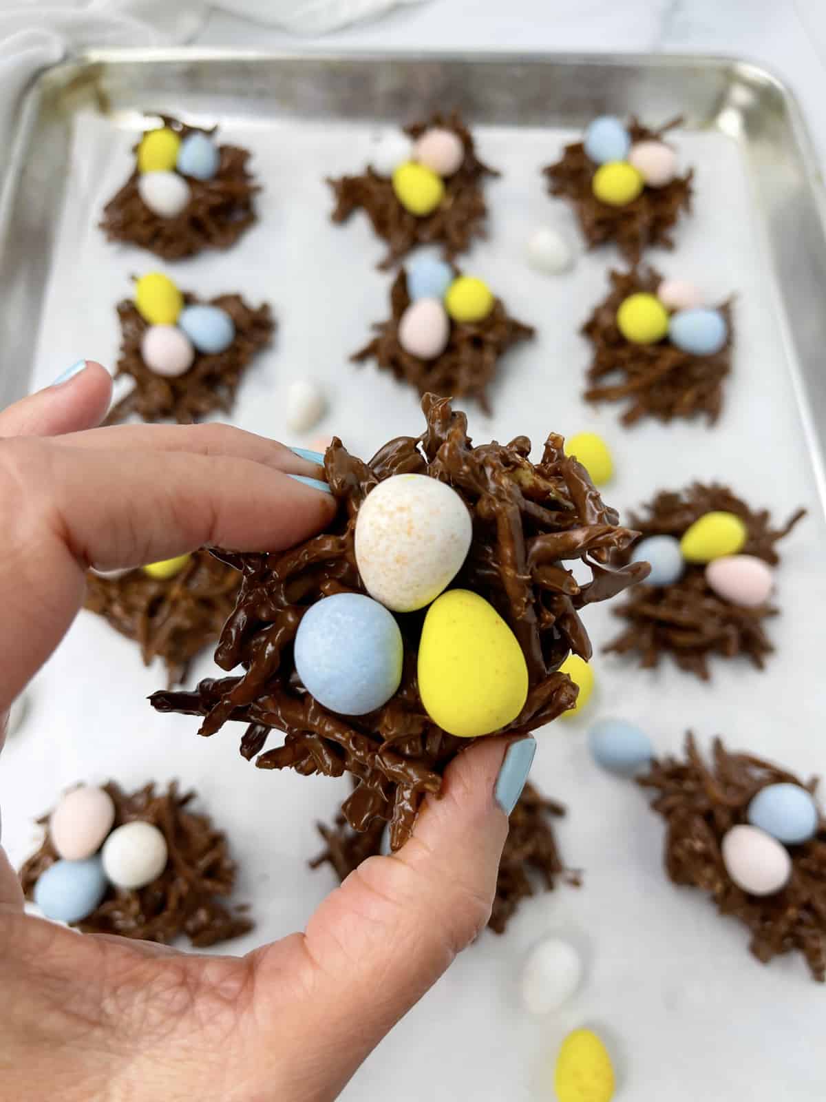 Chocolate haystack cookies with candy eggs.