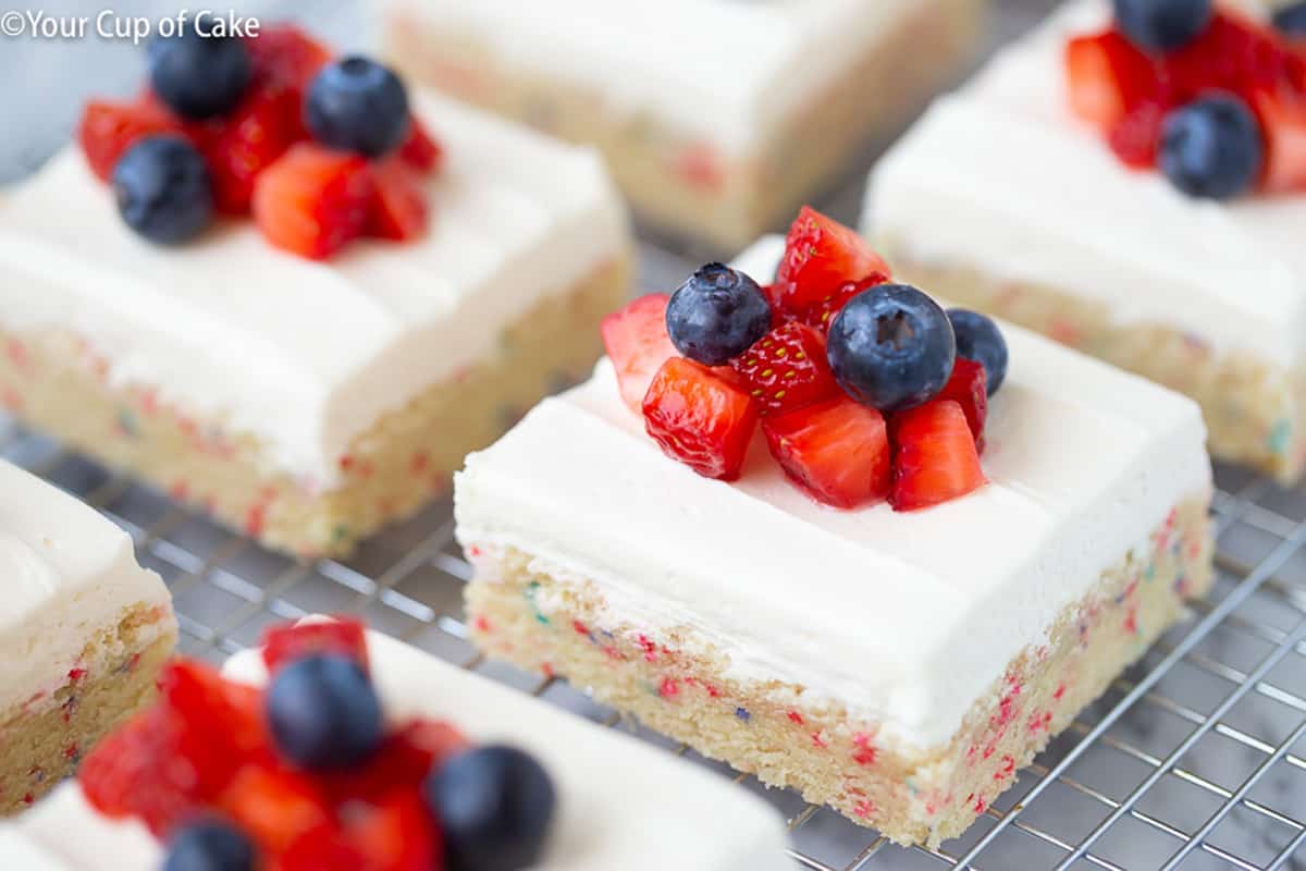 Sugar cookie bars with fresh berries on top.