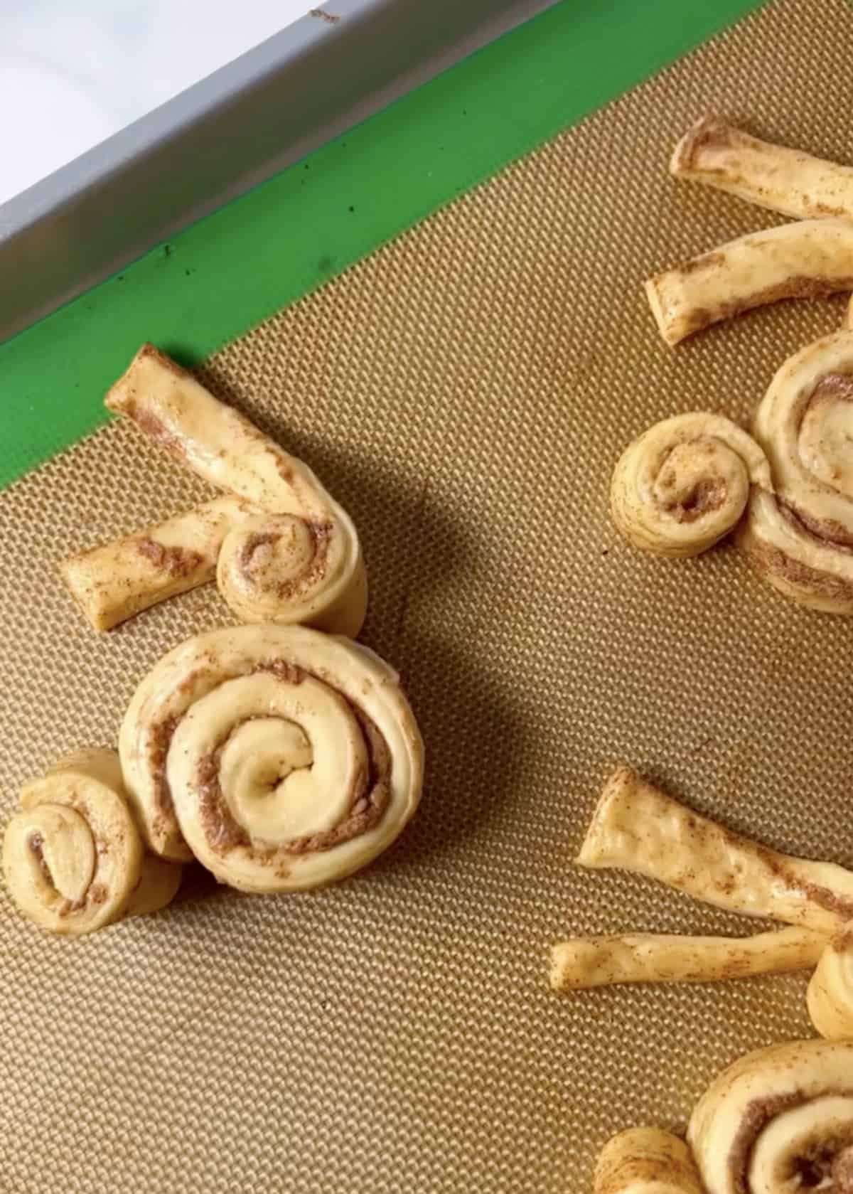 Baking sheet with bunny rolls.