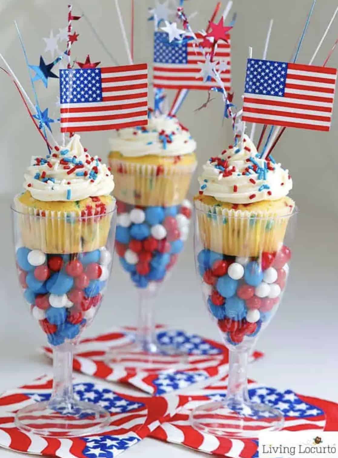 Patriotic cupcakes in fluted glasses with m and m's.