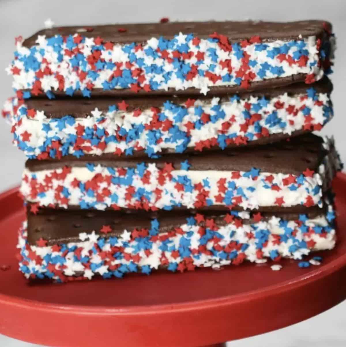 Ice cream sandwiches with sprinkles on the sides.