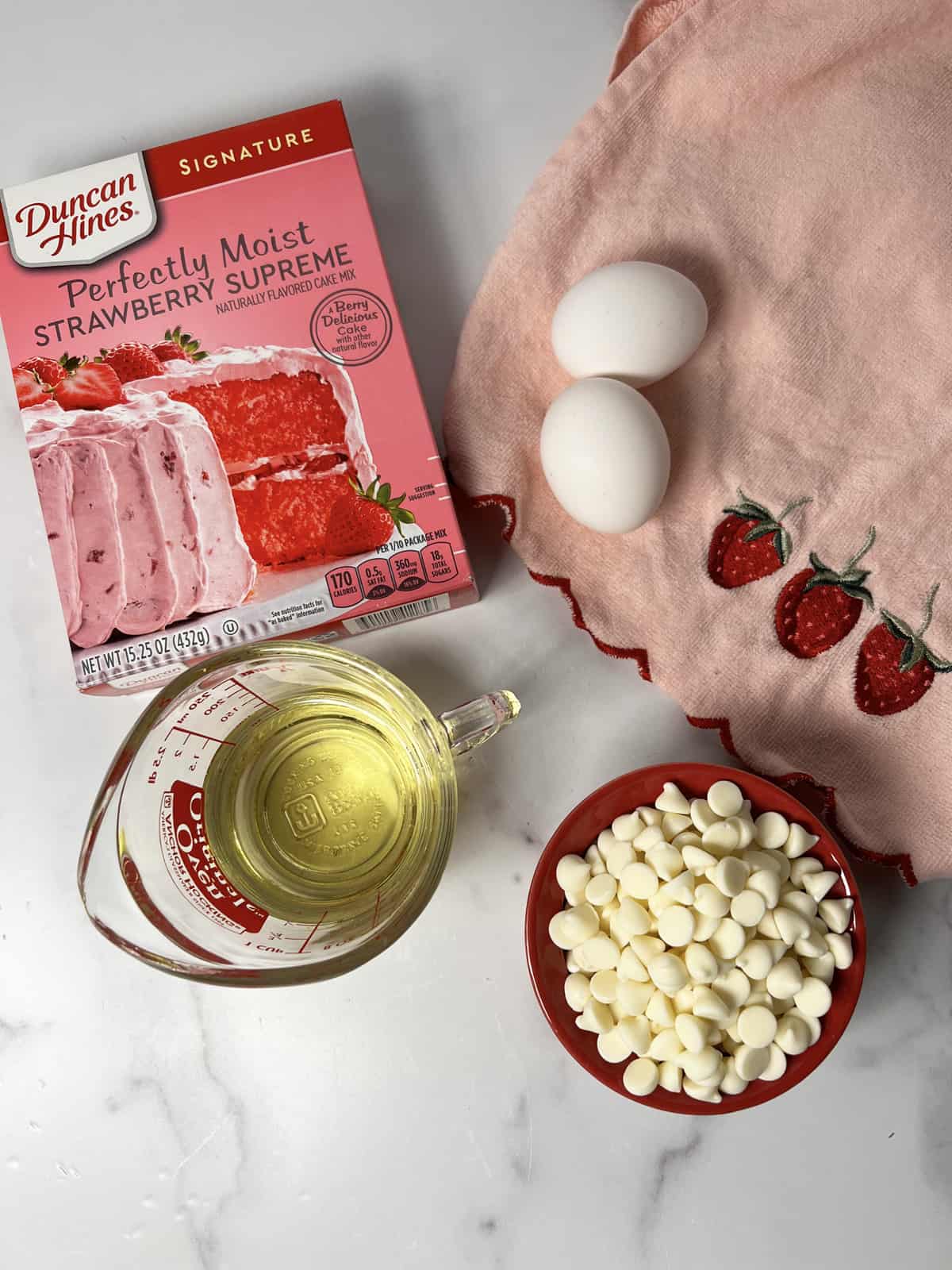 Ingredients needed to make strawberry cake mix cookies.