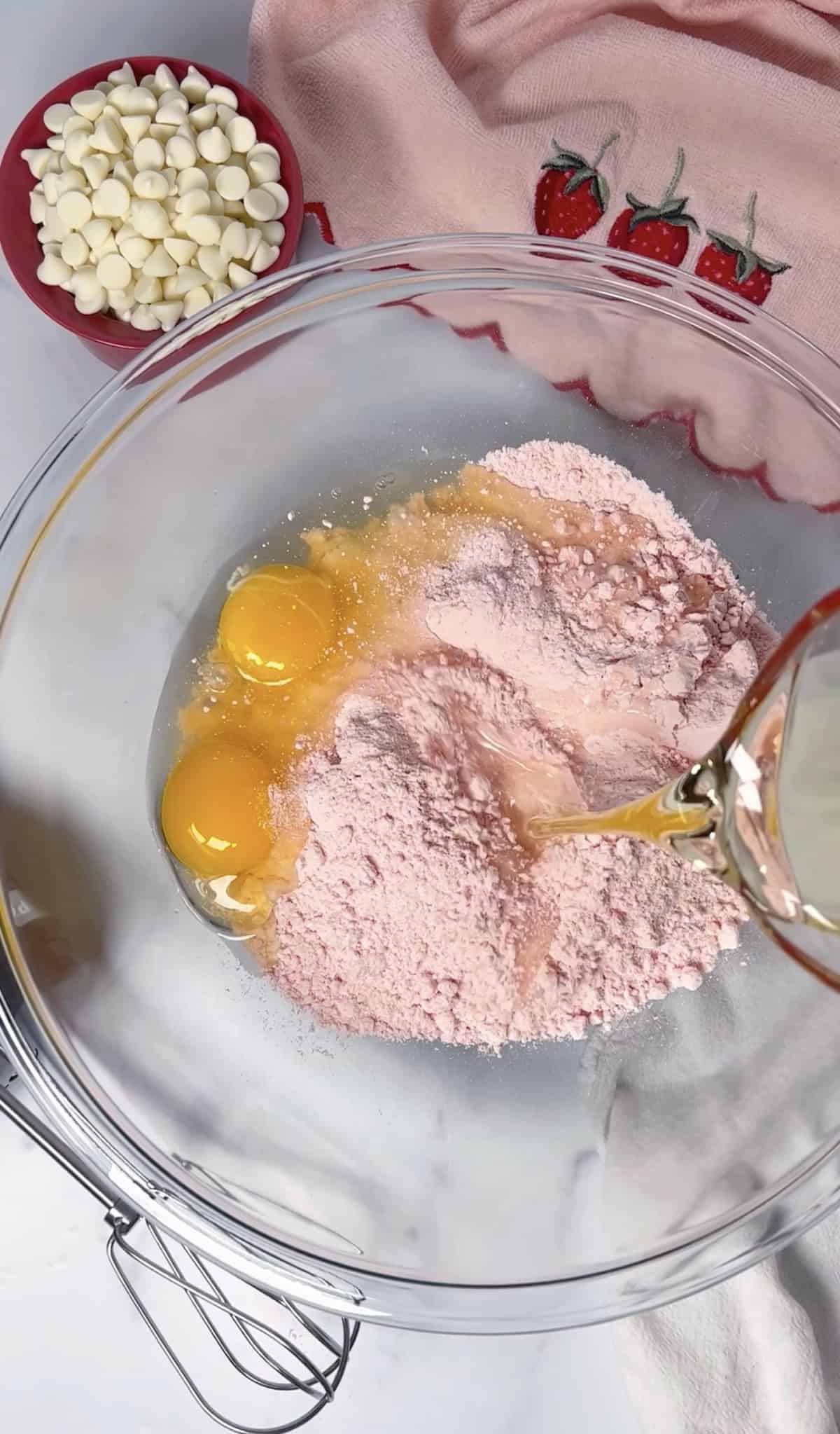 The first step in making cake mix cookies in a large bowl.