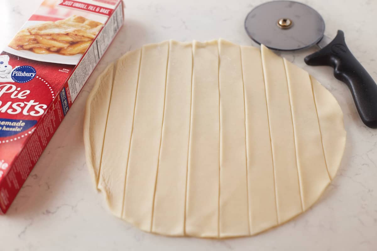 Store bought pie dough round cut with a pizza cutter.