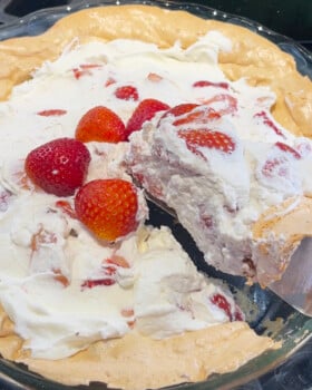 Cutting the strawberry angel pie.