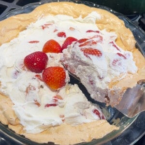 Cutting the strawberry angel pie.