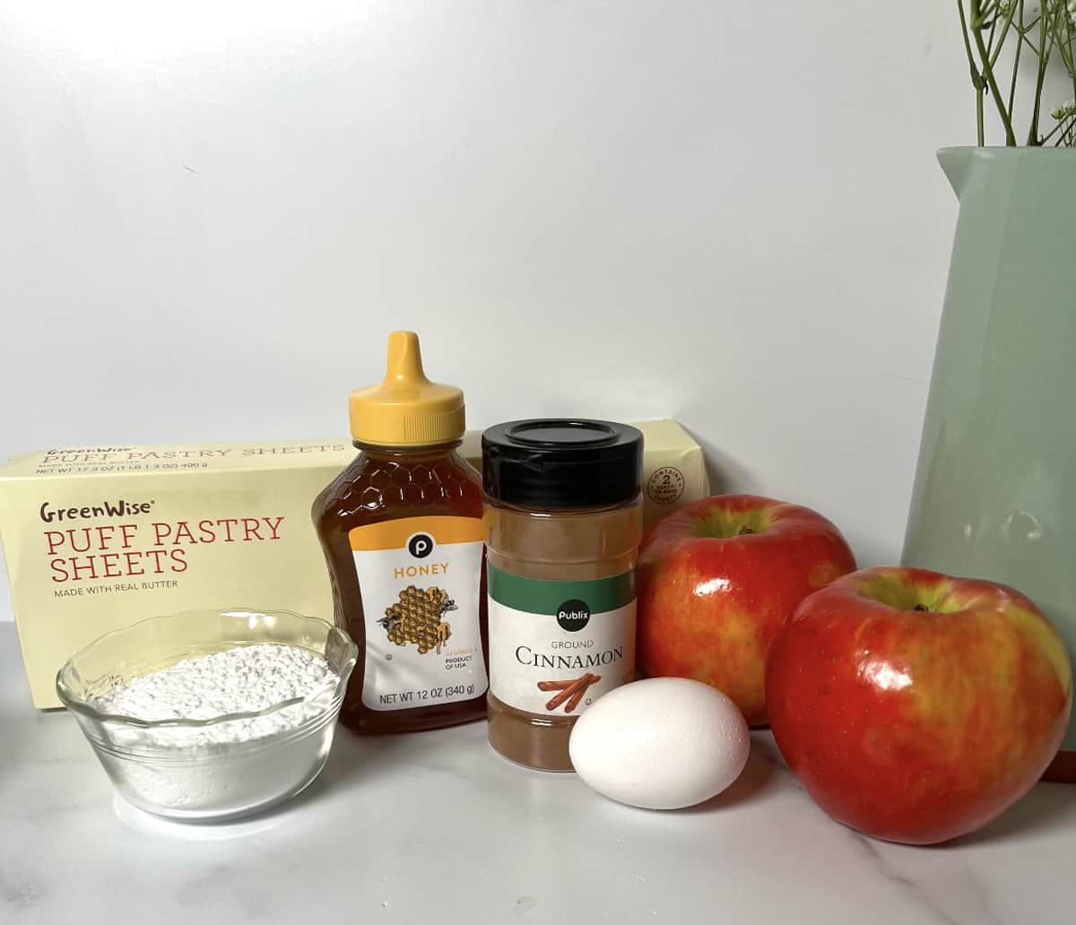 Ingredients needed to make homemade apple turnovers.