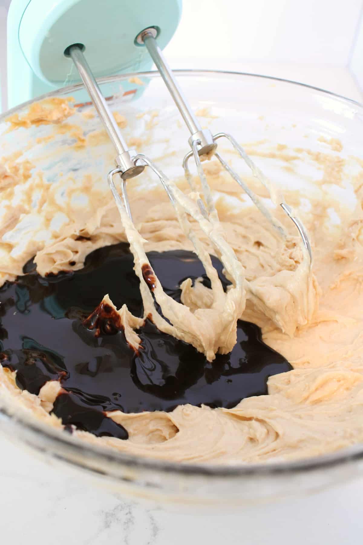 Mixing pie ingredients with an electric mixer.