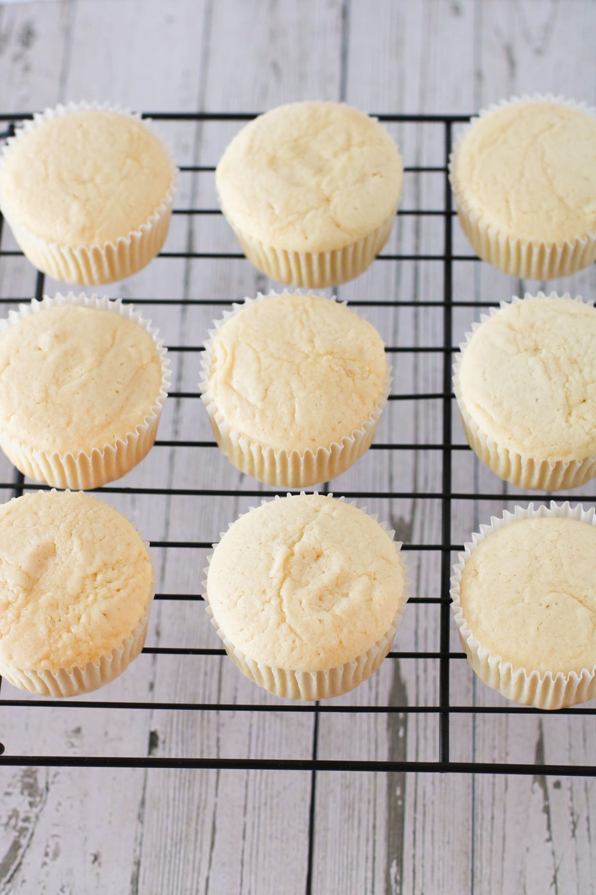 Baked cupcakes on cooling rack