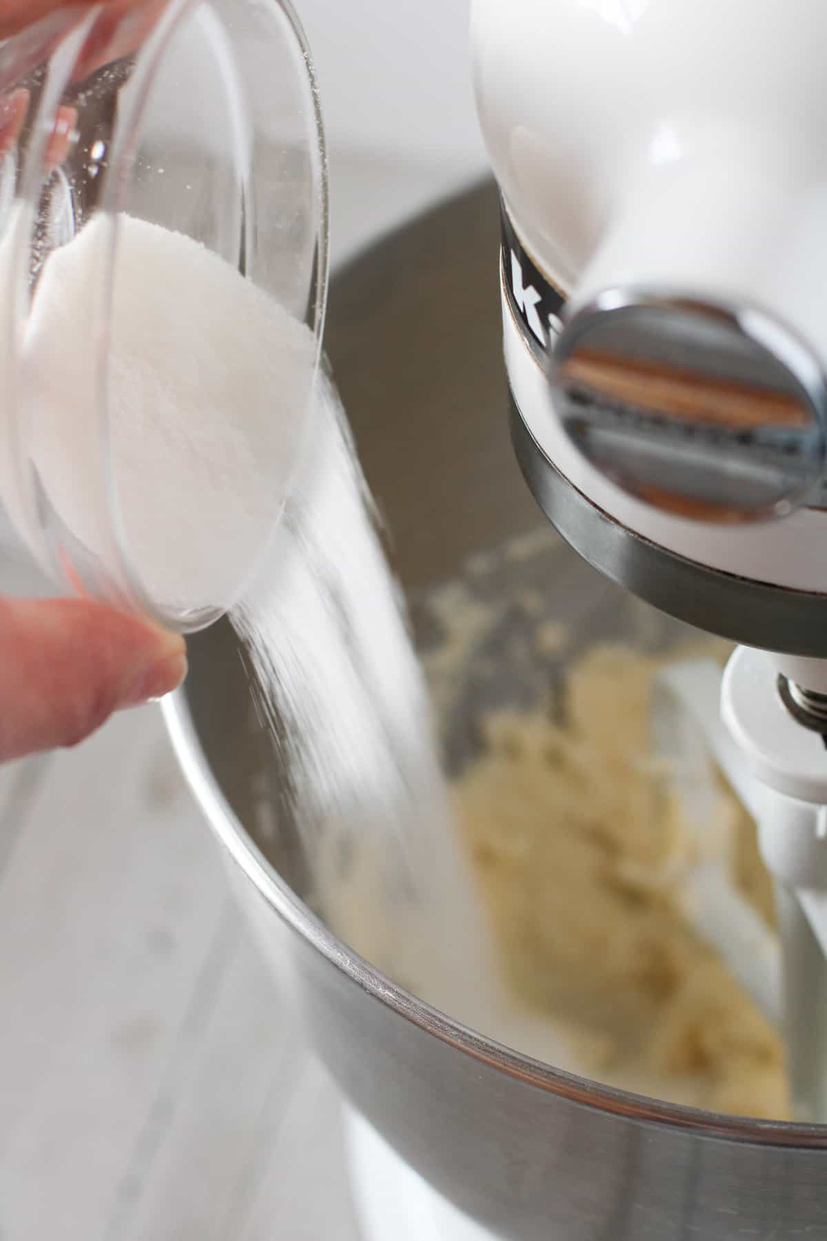 Kitchenaid mixer with cake batter in it.