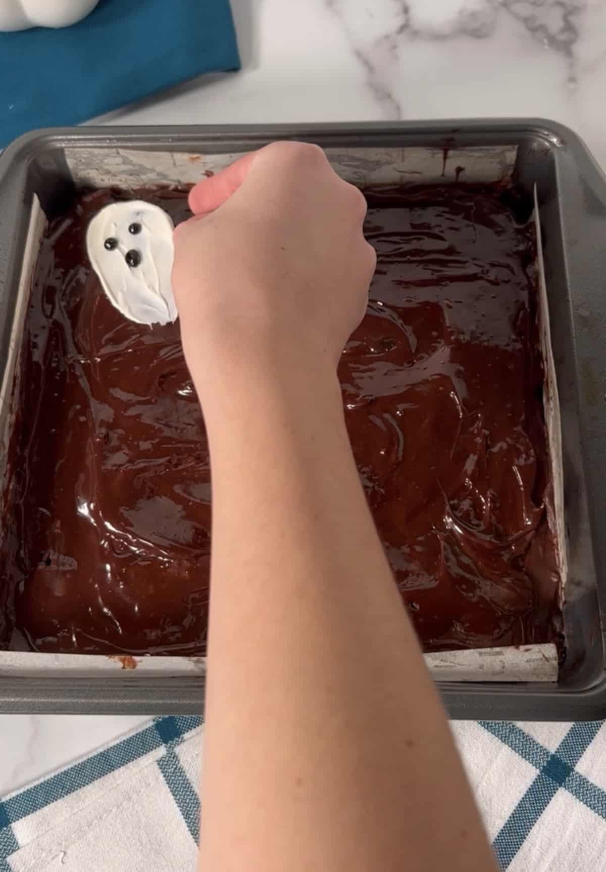 Frosted Halloween brownies in square pan.