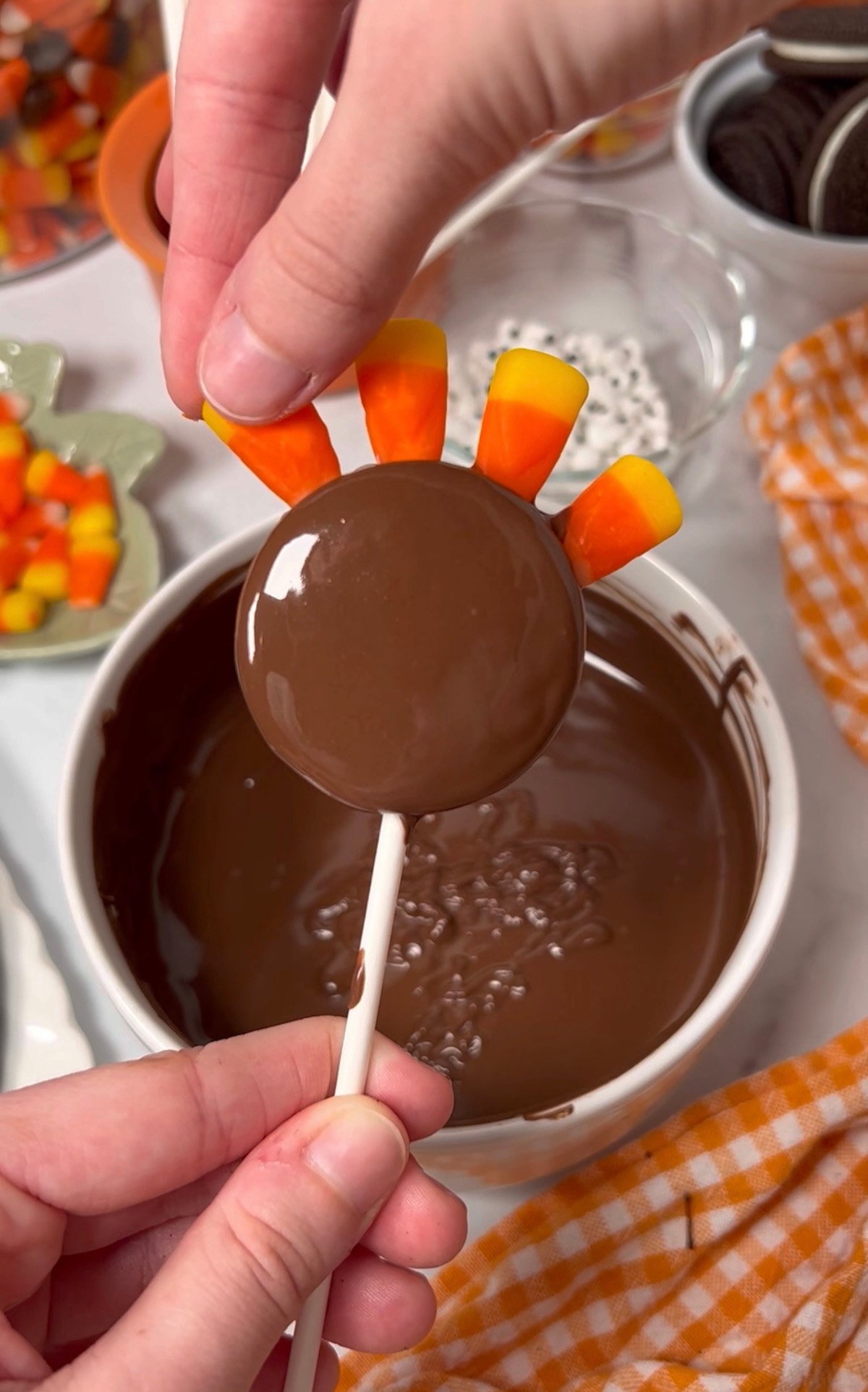 Decorating Oreo Cookies like a Thanksgiving Turkey.