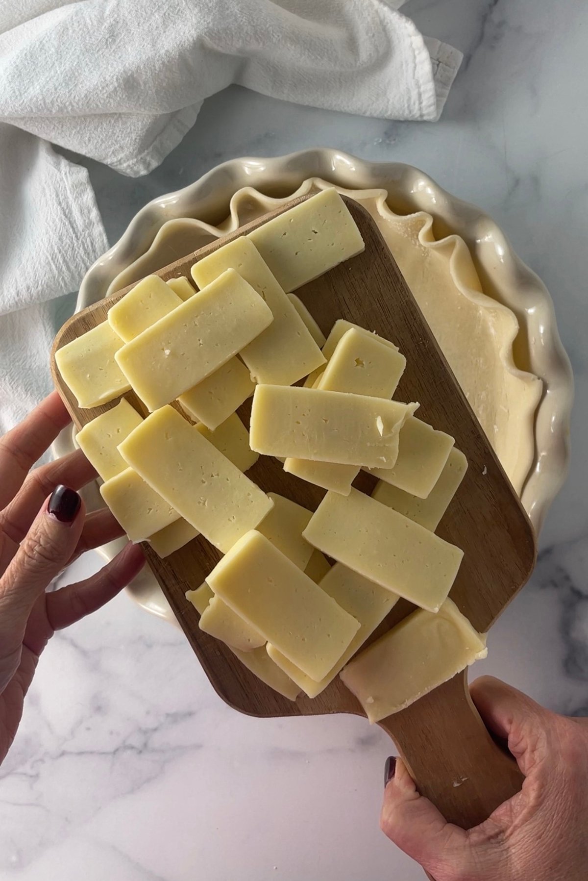 Sliced havarti cheese in pie crust.