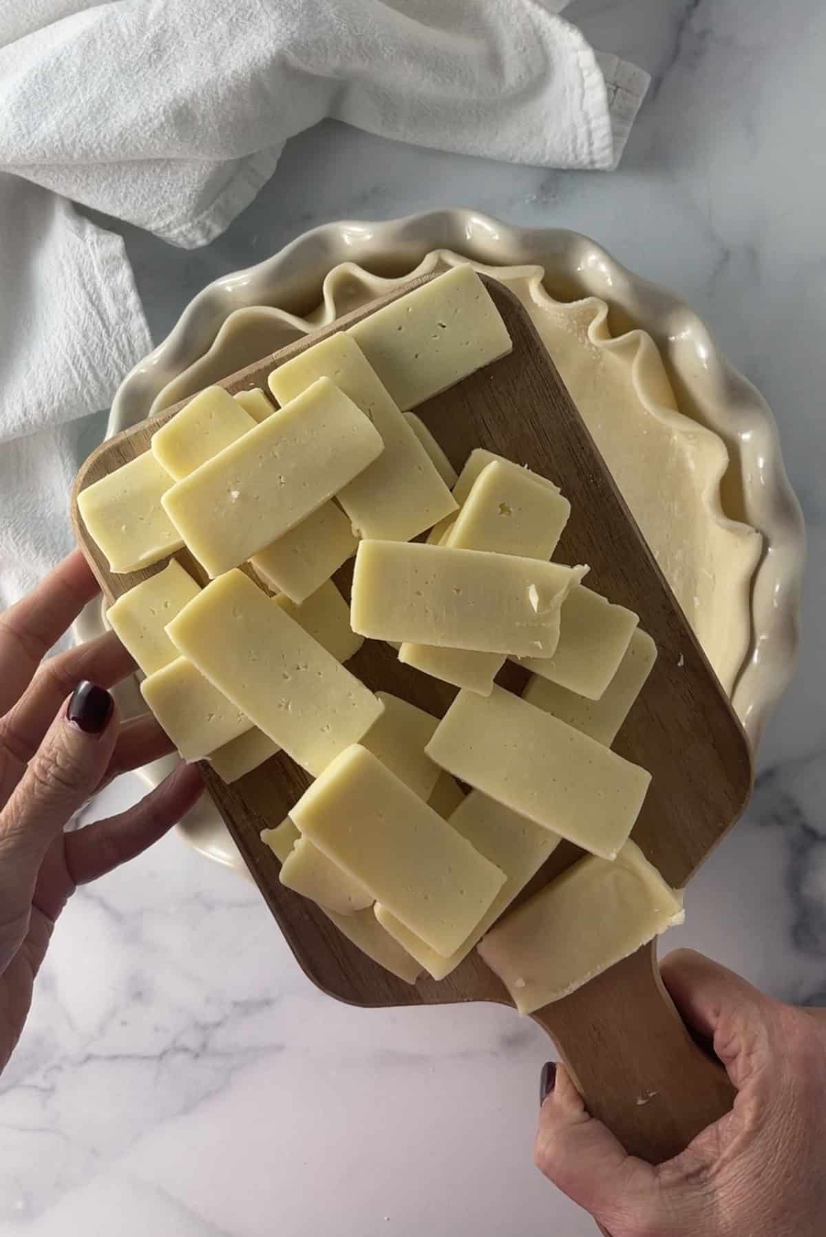 Sliced havarti cheese in pie crust.