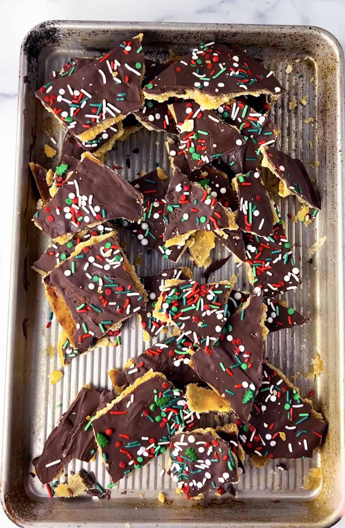 Easy Cracker Toffee Cookie Recipe on a half sheet pan.