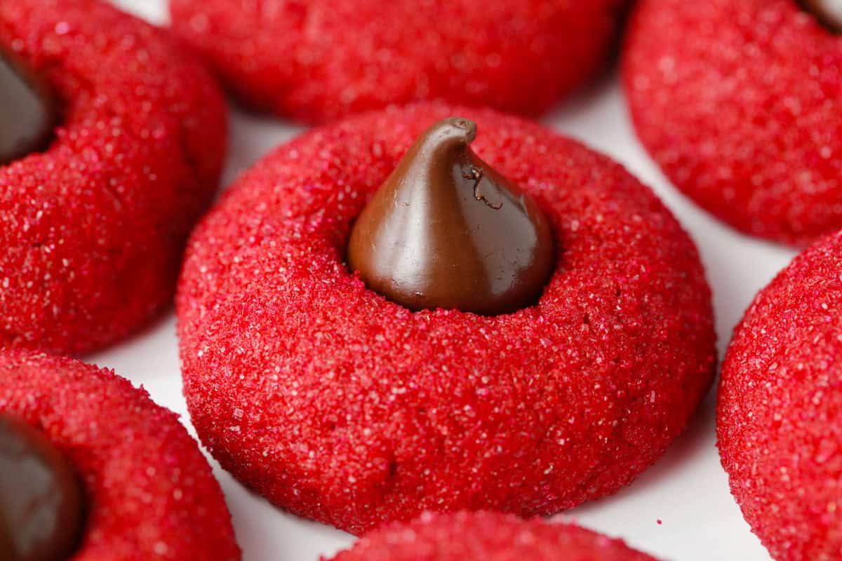 Red velvet thumbprint cookie dipped in red colored sugar.