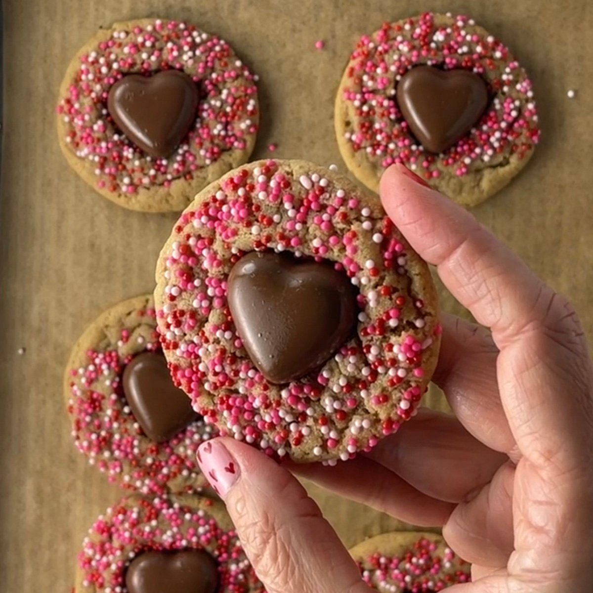 Valentine peanut butter blossoms with heart chocolate middle.