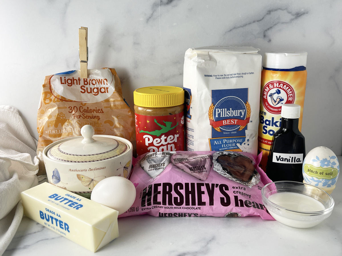 Ingredients needed to make Valentine peanut butter blossoms cookies.