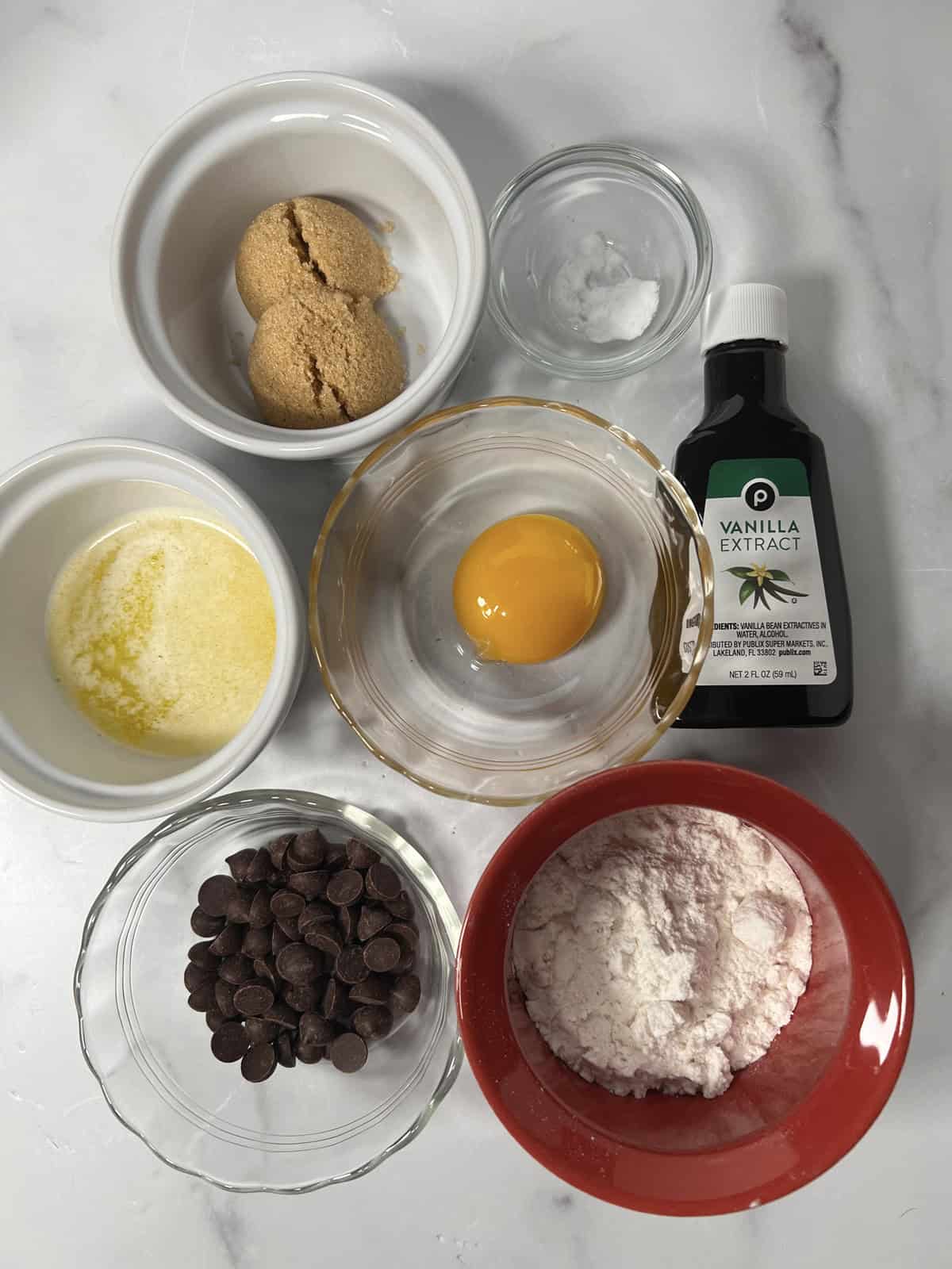 Ingredients needed to make an easy chocolate chip mug cookie.