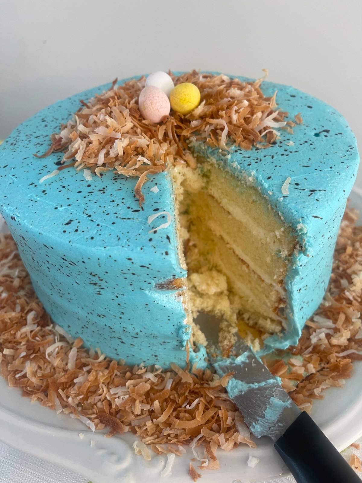 Sliced yellow cake decorated for Easter.
