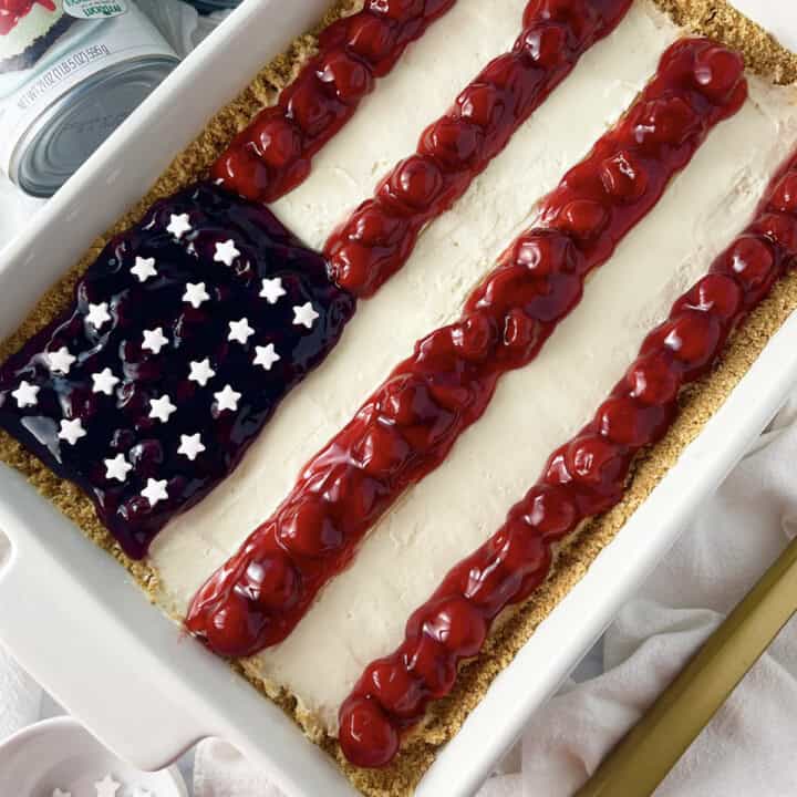 American flag cheesecake no bake dessert in a white oblong casserole dish.