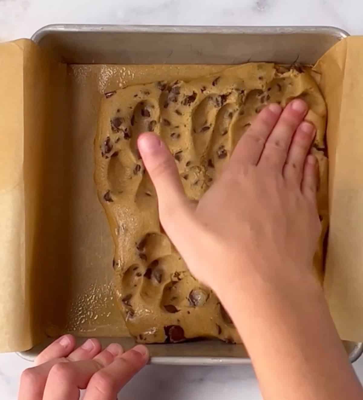 Press cookie dough into pan.