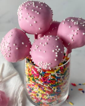 Copycat Starbucks cake pops in a jar of sprinkles.