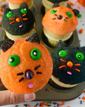 Kitty cat cupcakes in ice cream cones.