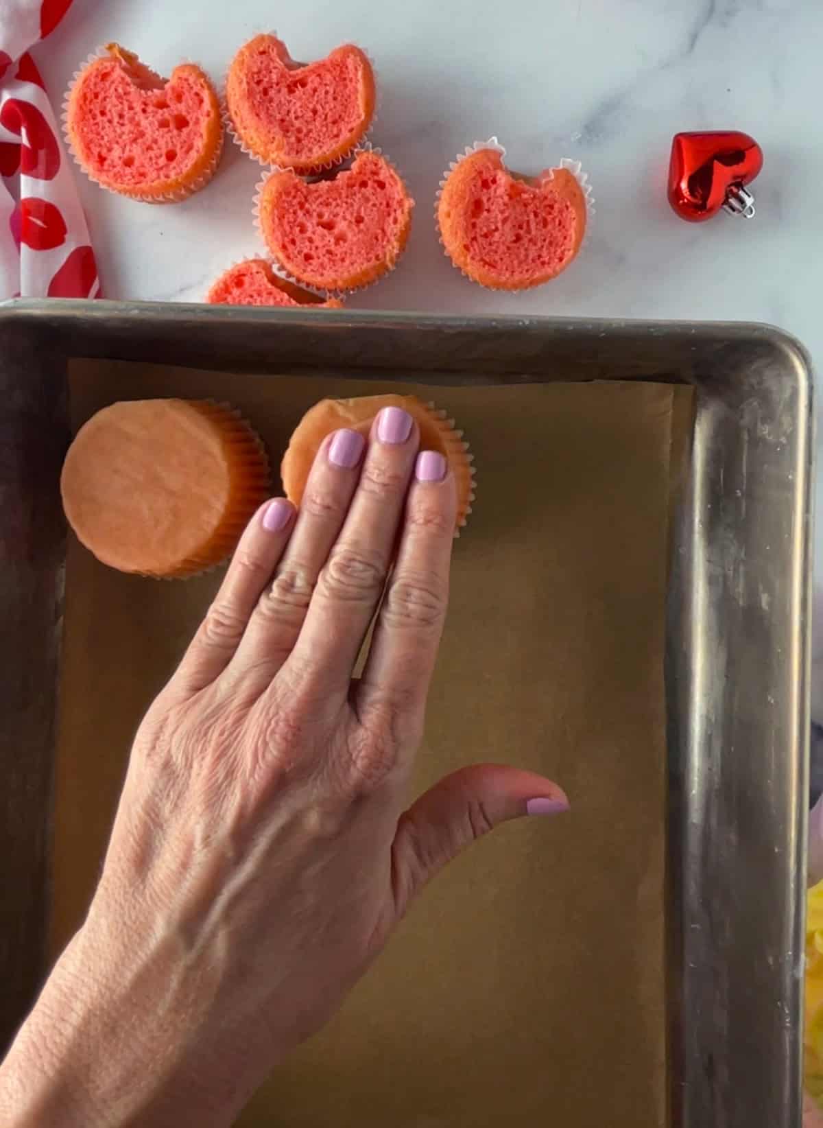 Freeze cupcakes upside down in pan.