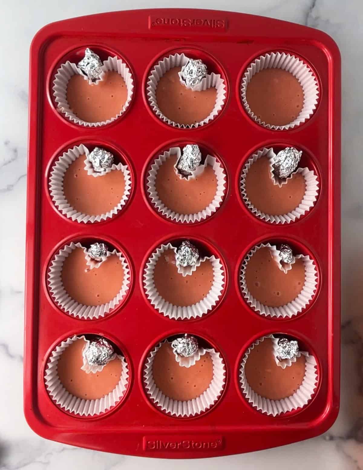 Heart shaped cupcakes in pan.
