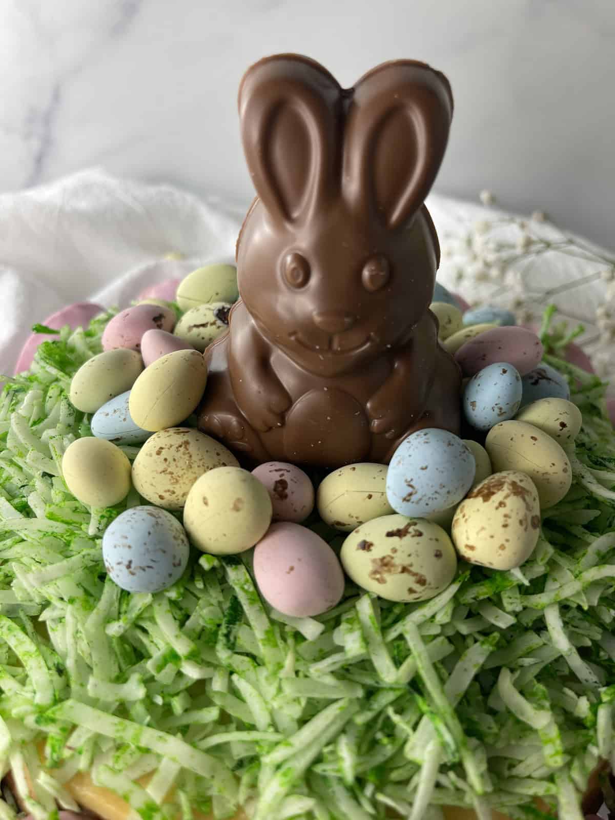 Easter cake with chocolate bunny on top.