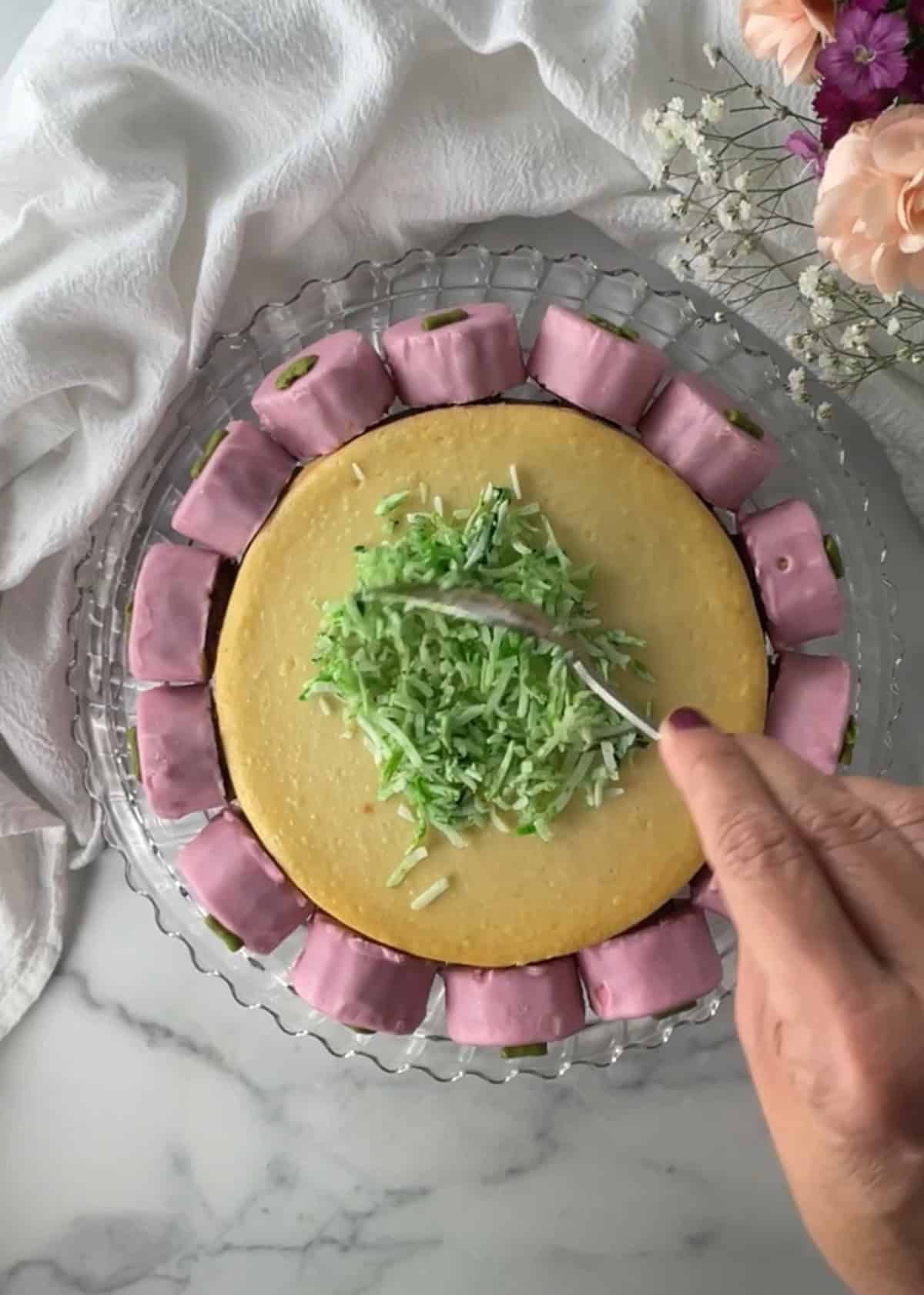 Green coconut on top of cake.