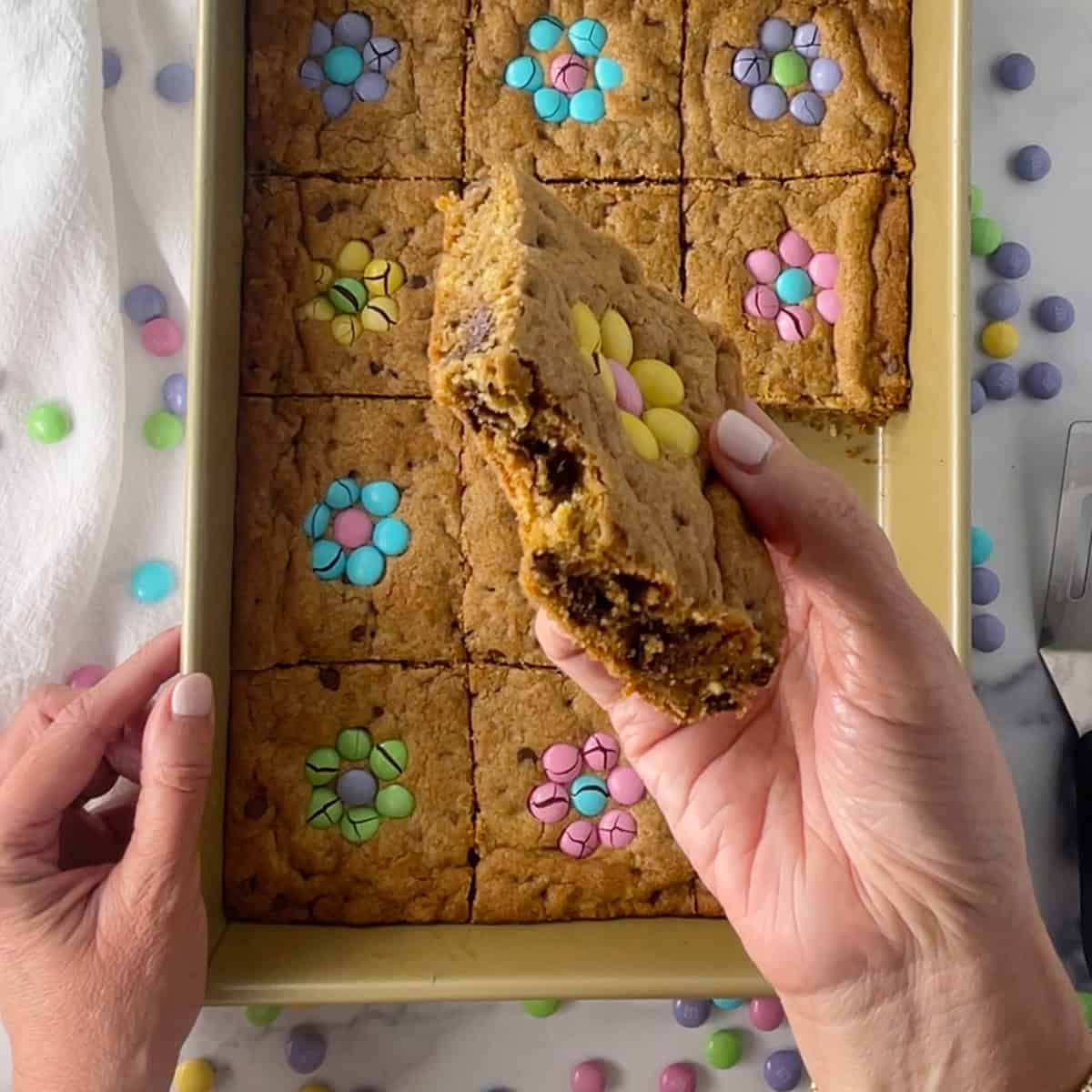 Easter cookie bar with bite taken out.