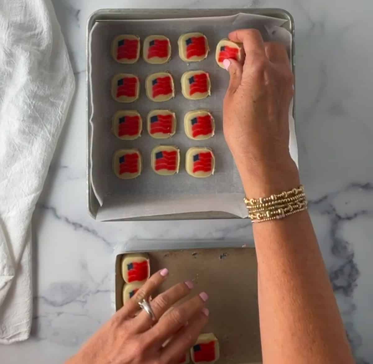 Placing Pillsbury flag cookie dough into baking pan.