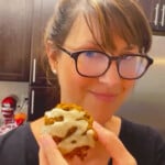 Baker Lise Ode holding a yummy iced pumpkin oatmeal cookie.