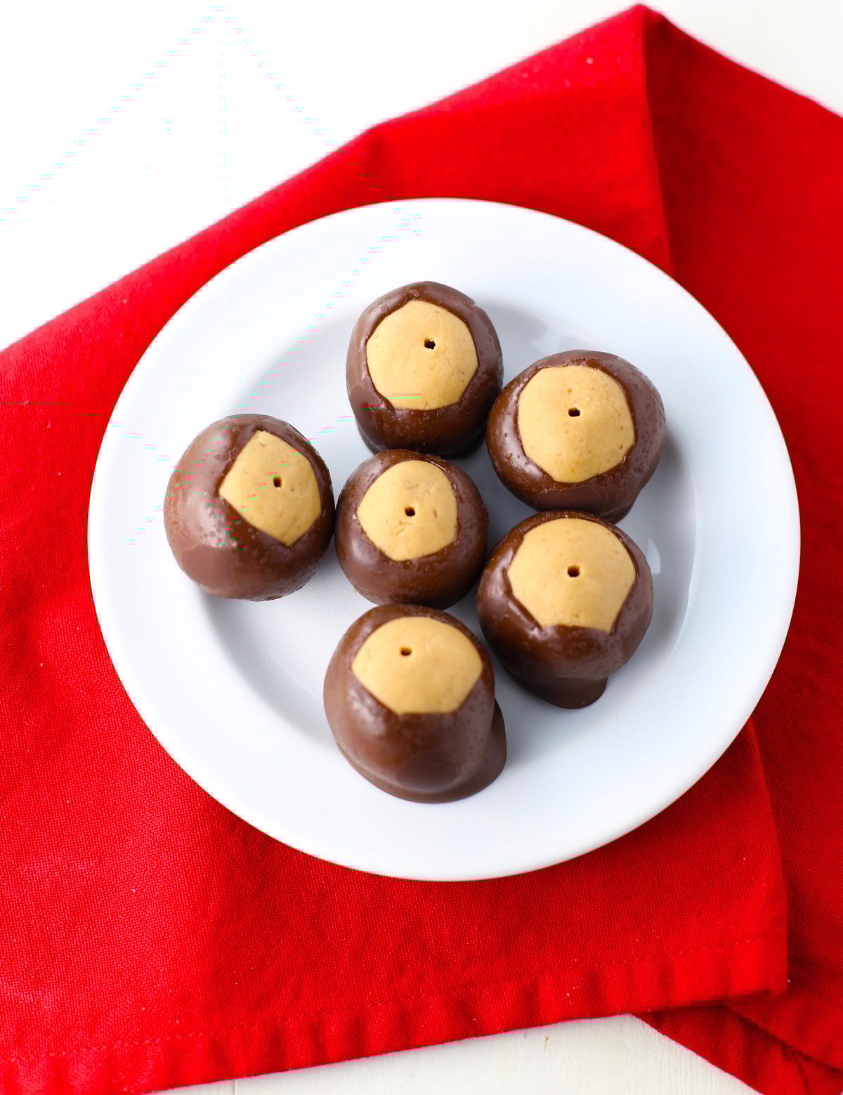 Festive holiday tray filled with no bake peanut butter buckeye candy.