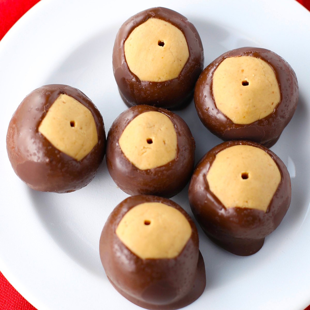 Close-up of classic peanut butter buckeye candies with creamy centers and chocolate coating.