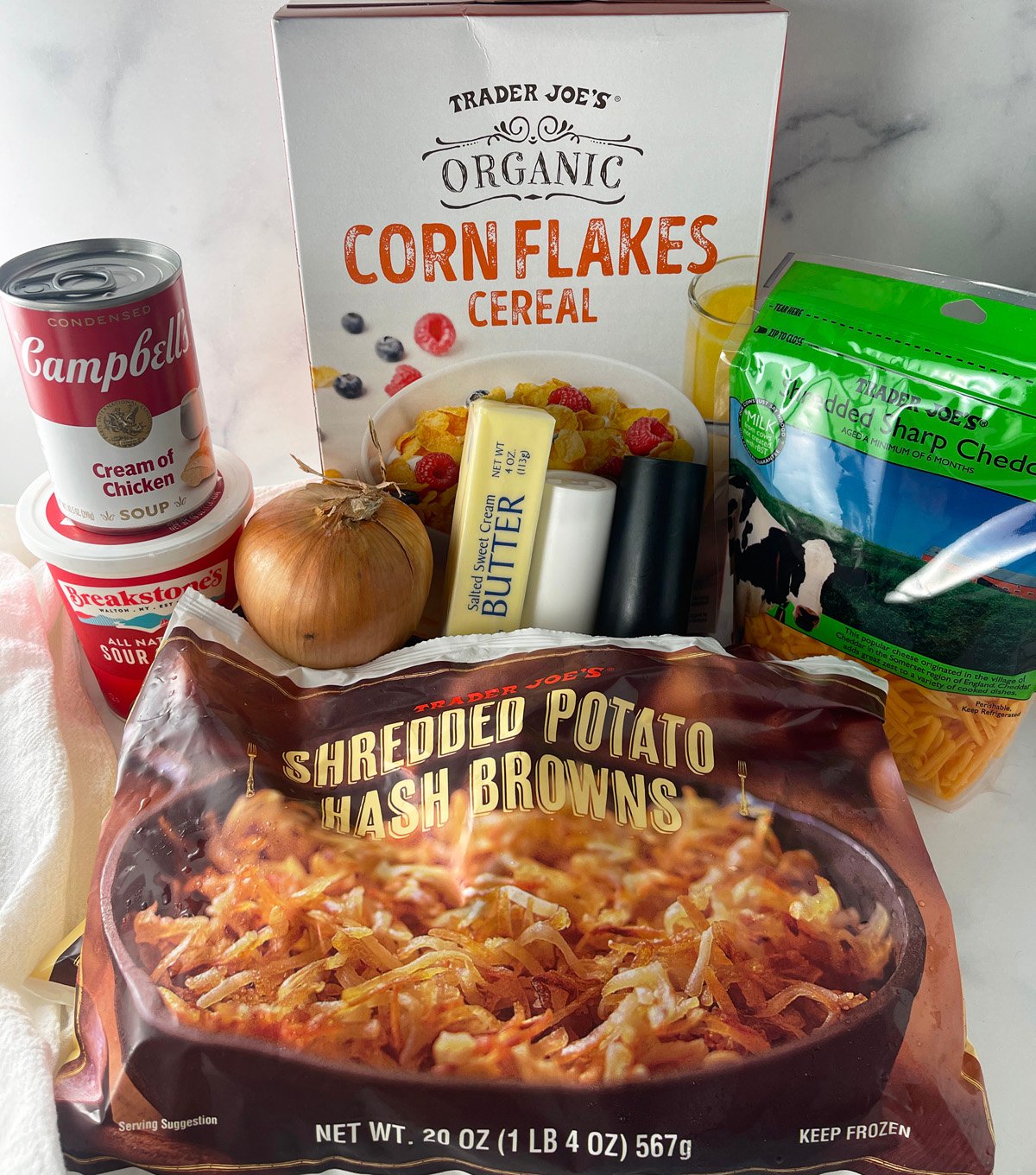 All the ingredients needed to make a Funeral Potatoes casserole.