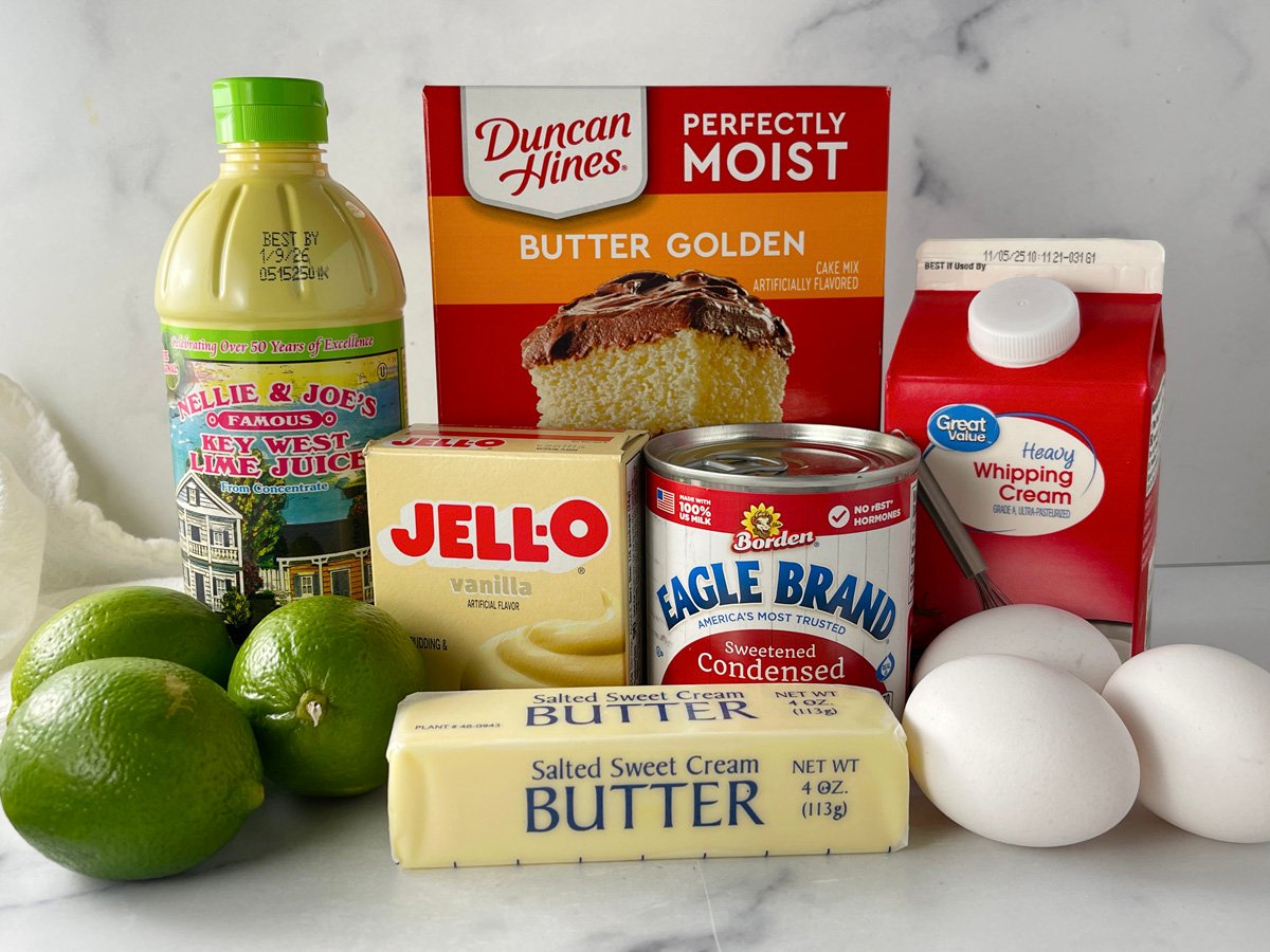 ngredients for key lime layer cake including cake mix, instant pudding, key lime juice, sweetened condensed milk, and heavy cream