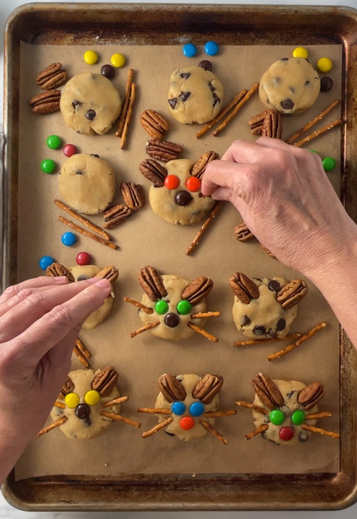 Decorating kitty cat cookies.