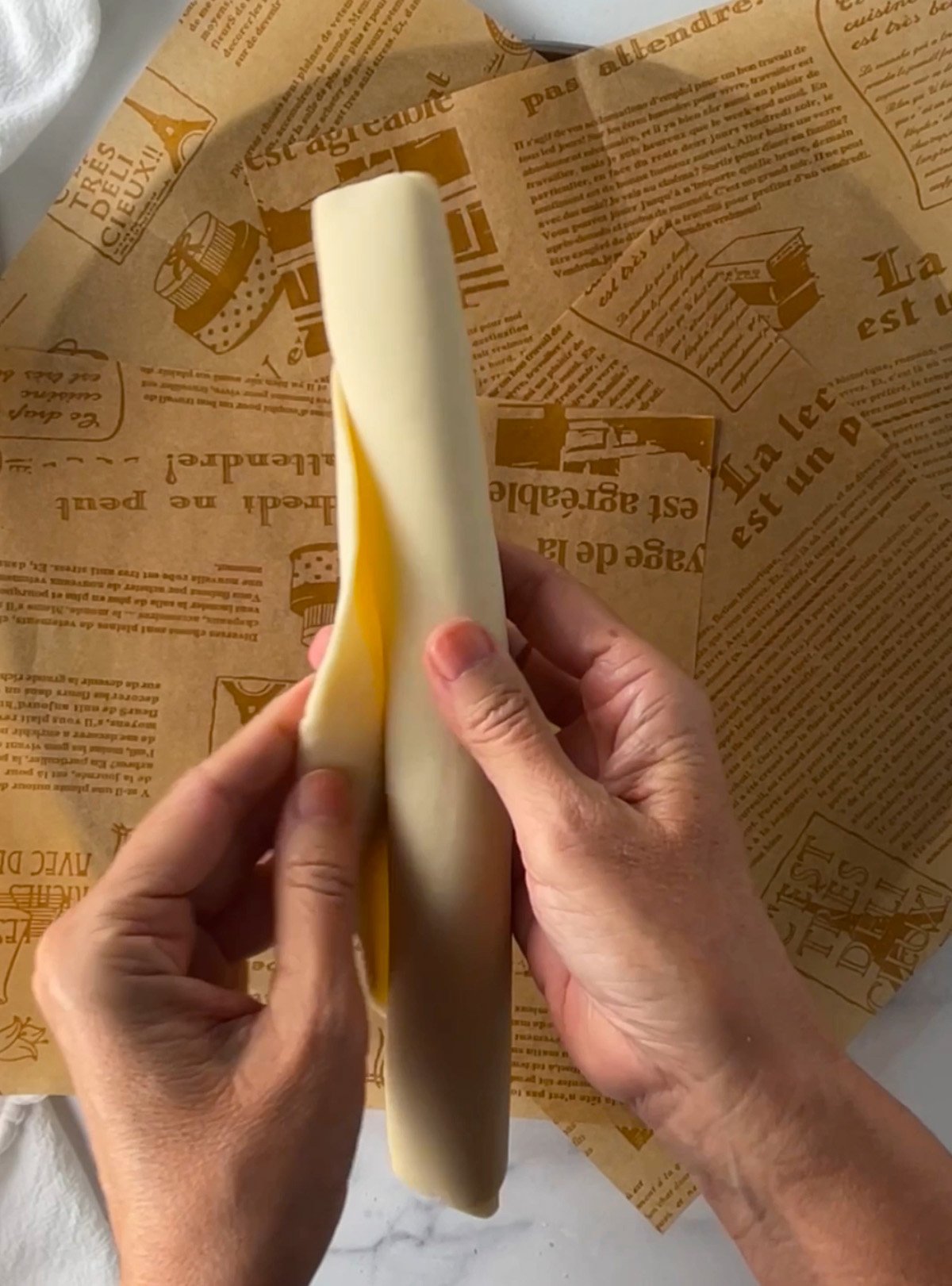 Unrolling refrigerated pie crust dough.
