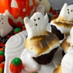 Close up of toasted marshmallow on top of chocolate cupcake with Ghost peep.